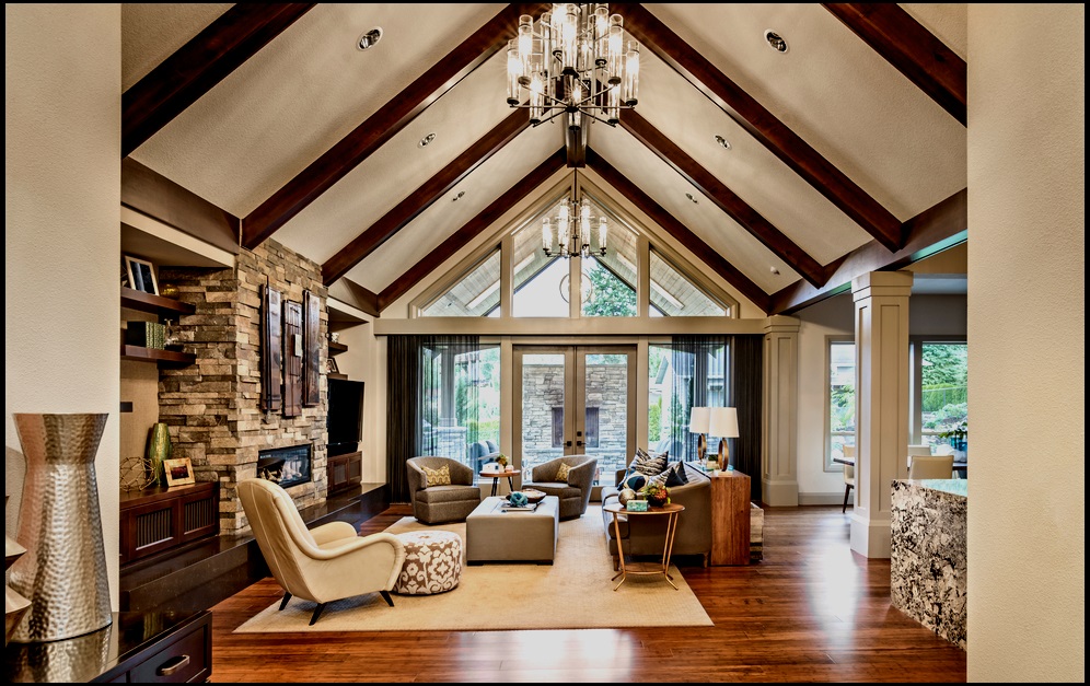 A contemporary keeping room uses natural stone and exposed beams to balance the light from big windows.