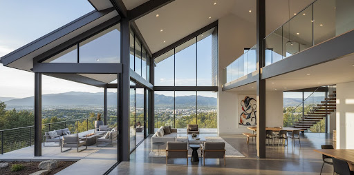 Denver house plan interior with soaring glass walls, open-concept living area, floating staircase, and panoramic mountain and city views.